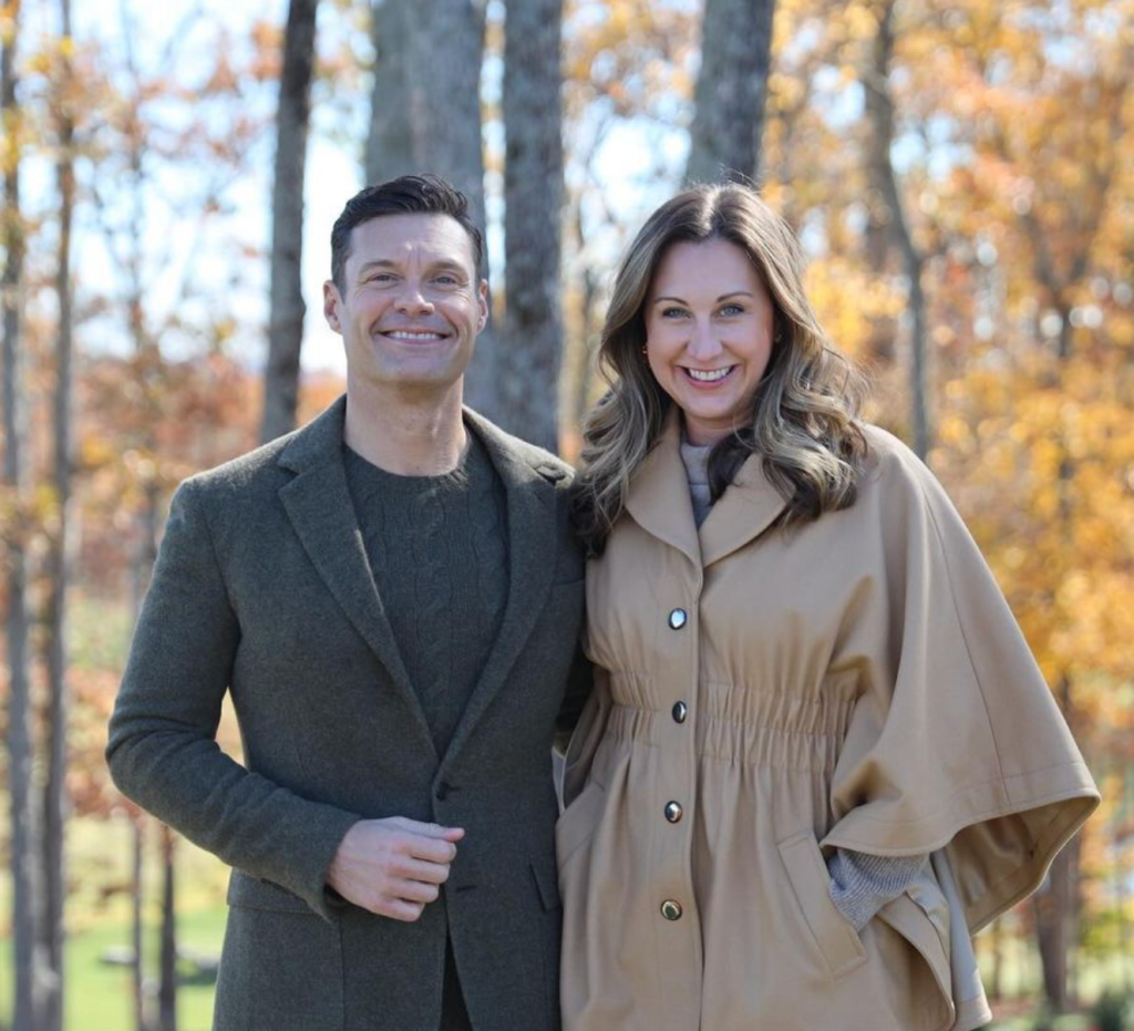 Ryan Seacrest posing with his sister Meredith 